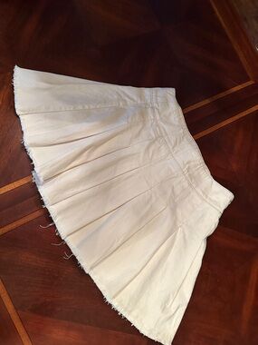 We The Free Cream Pleated Mini Skirt with Raw Hem